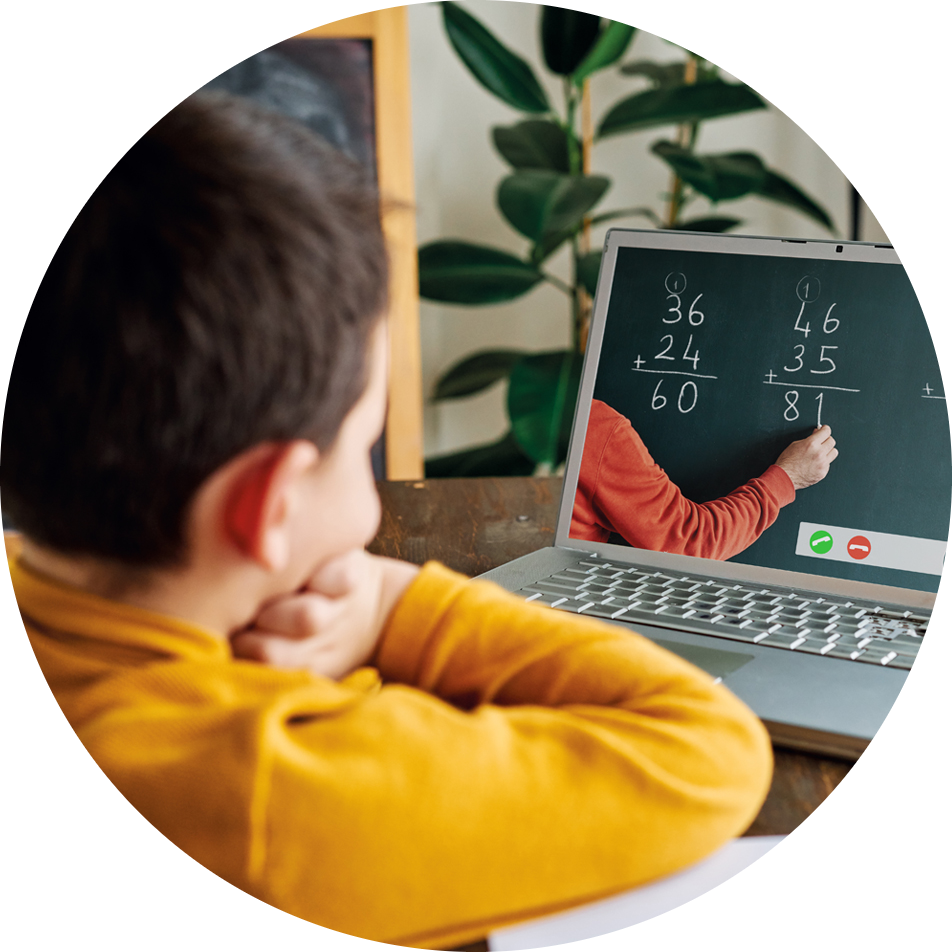 a child looking at a laptop studying math